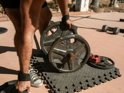 Close up of a man focusing before lifting a weight